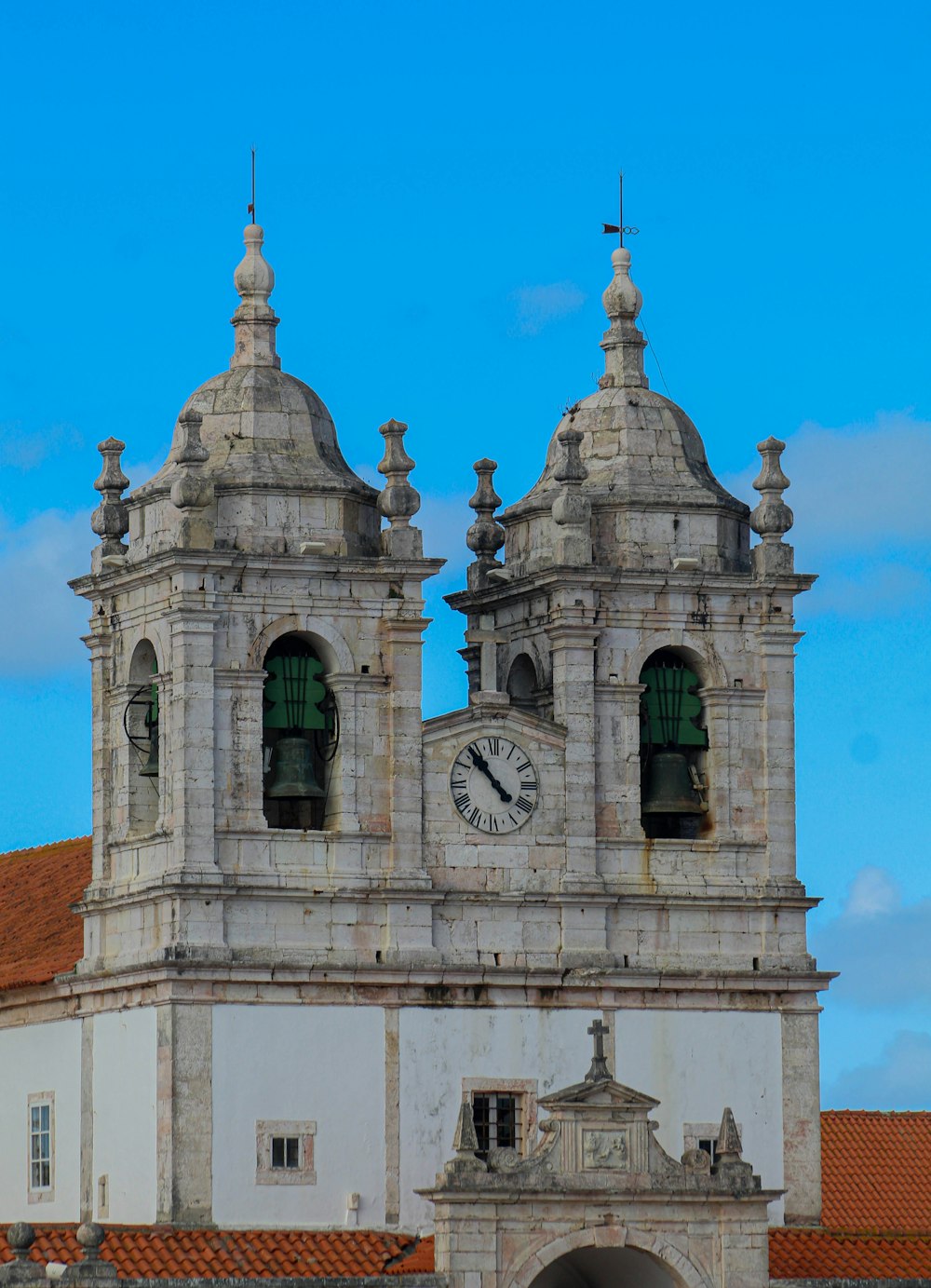 a large white building with a clock on it's side