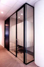 a room with a bunch of glass doors in it