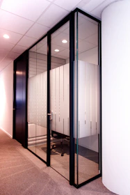 a room with a bunch of glass doors in it