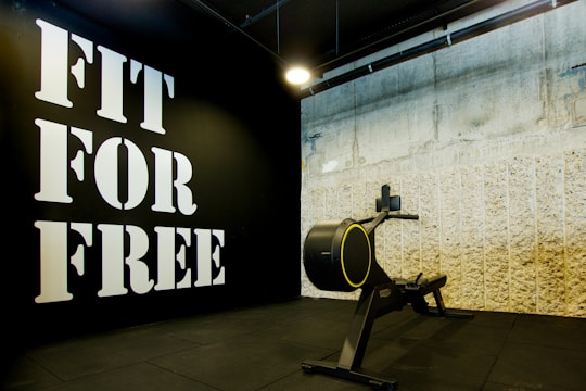 a black wall with a sign that says fit for free