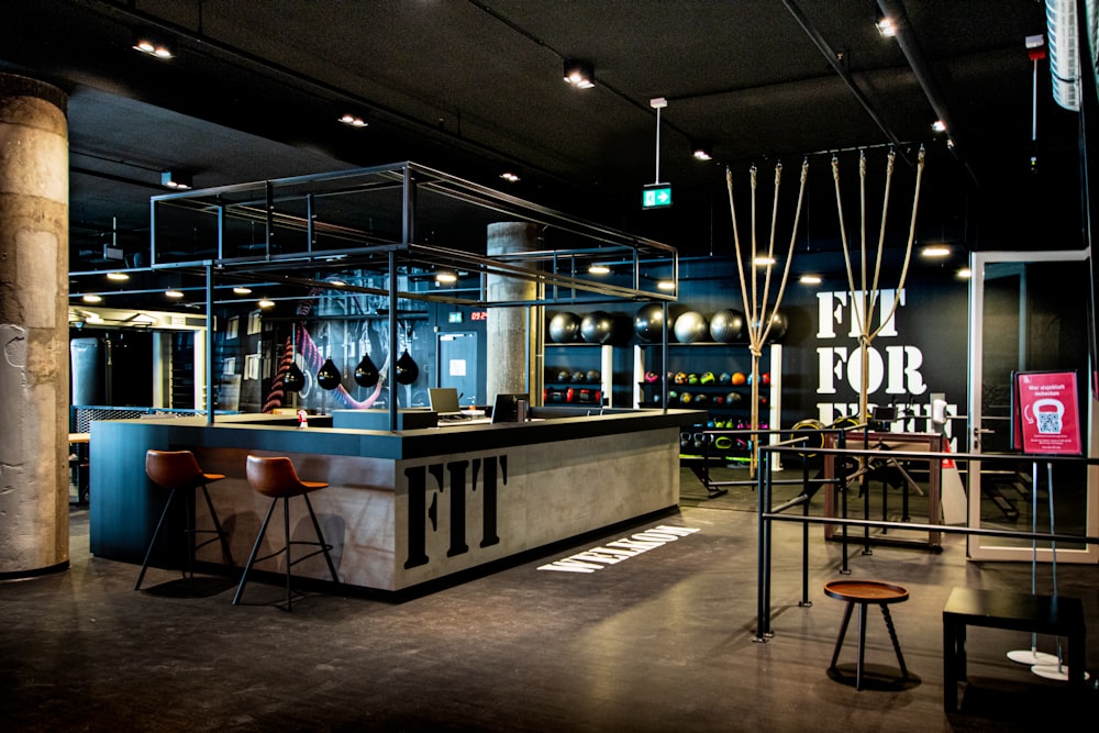 a bar with stools and a counter in a room