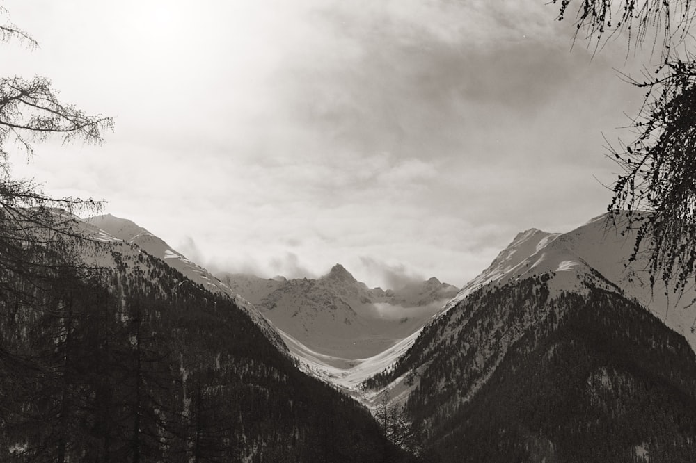 a black and white photo of a mountain range