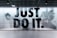 A large, bold slogan 'JUST DO IT.' is displayed with an action-packed background featuring a blurred image of a person running. The wall is part of an interior with a modern design, and there is a sign on the right side welcoming people to Nike, highlighting various aspects like experts, sport, and rewards. The color scheme is predominantly monochrome.