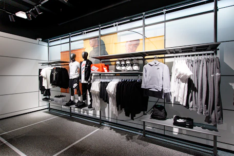 a display case with a variety of clothing on display