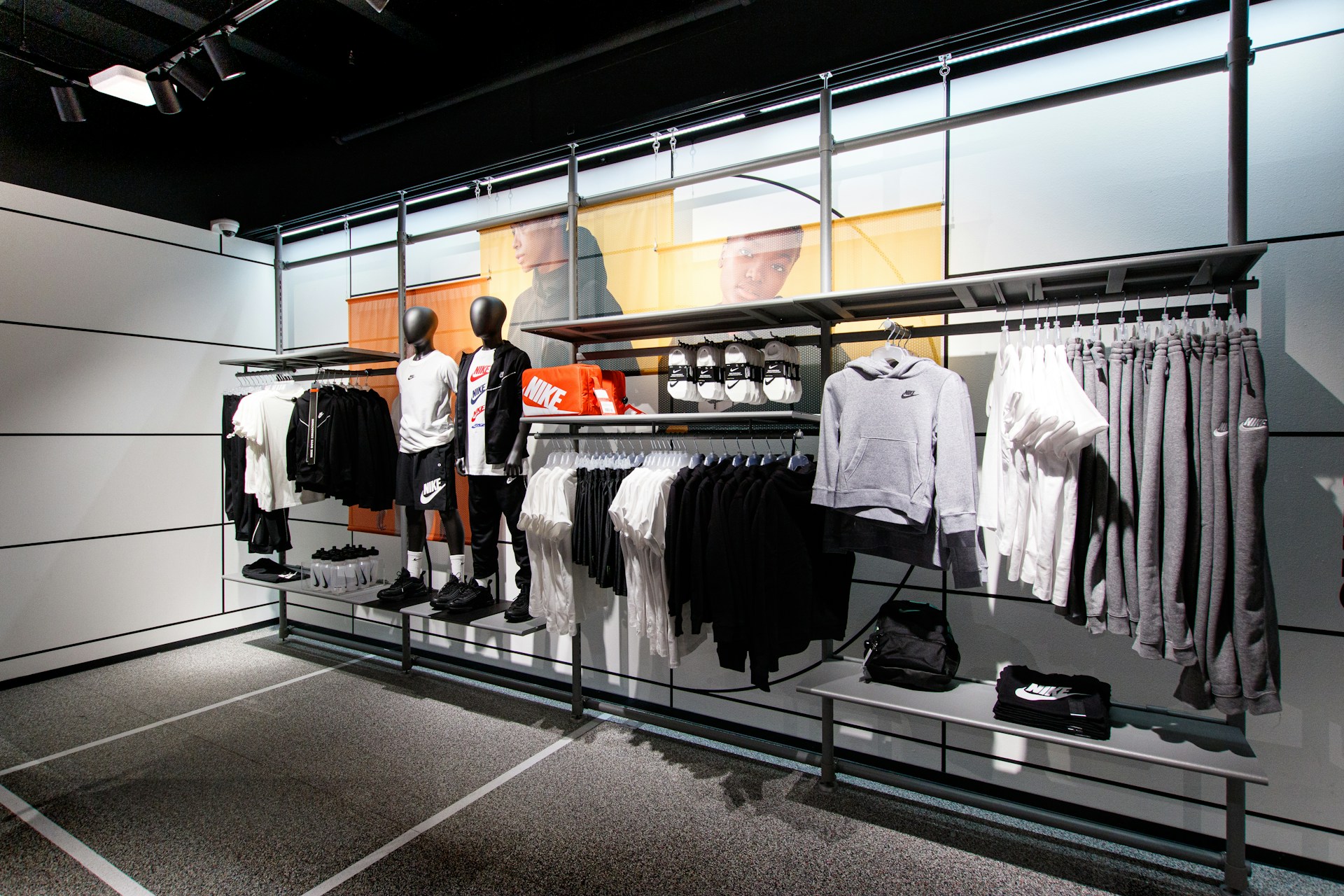 a display case with a variety of clothing on display
