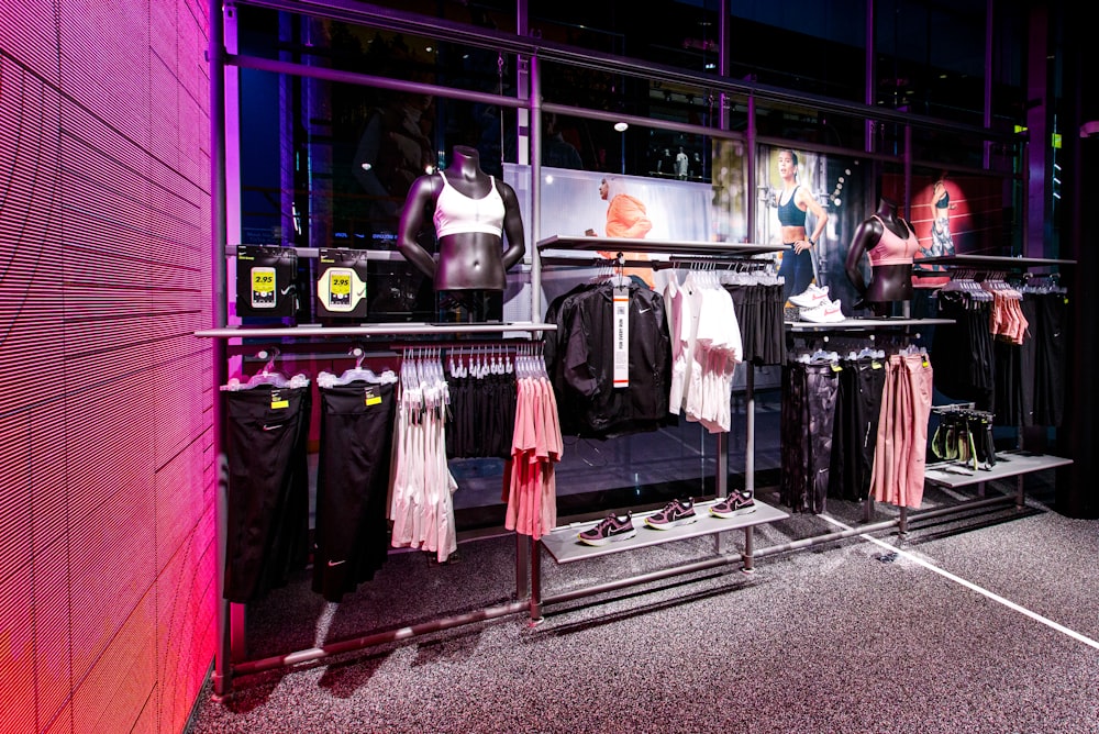 a clothing store display with mannequins and shirts