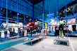 Close-up of sleek, colorful fitness apparel hanging on a rack in a bright, airy store setting.