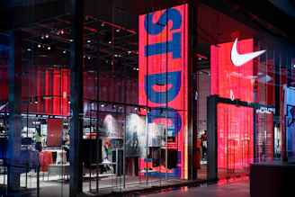 a nike store with red and blue lighting