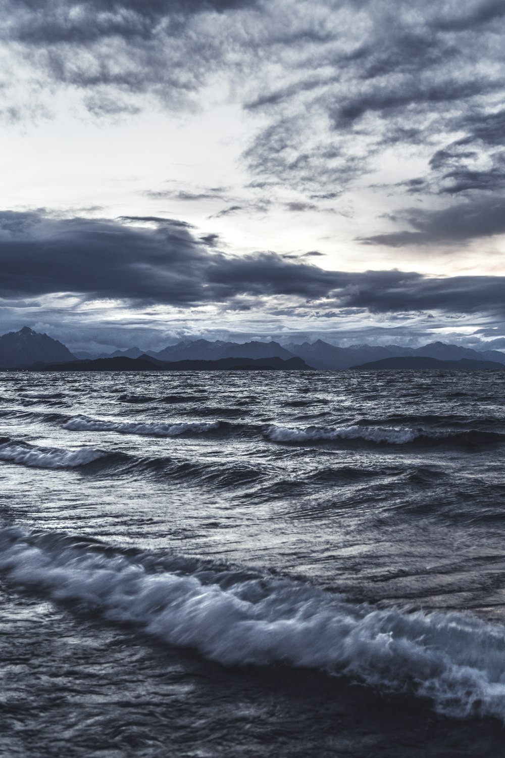 a body of water with waves coming in to shore