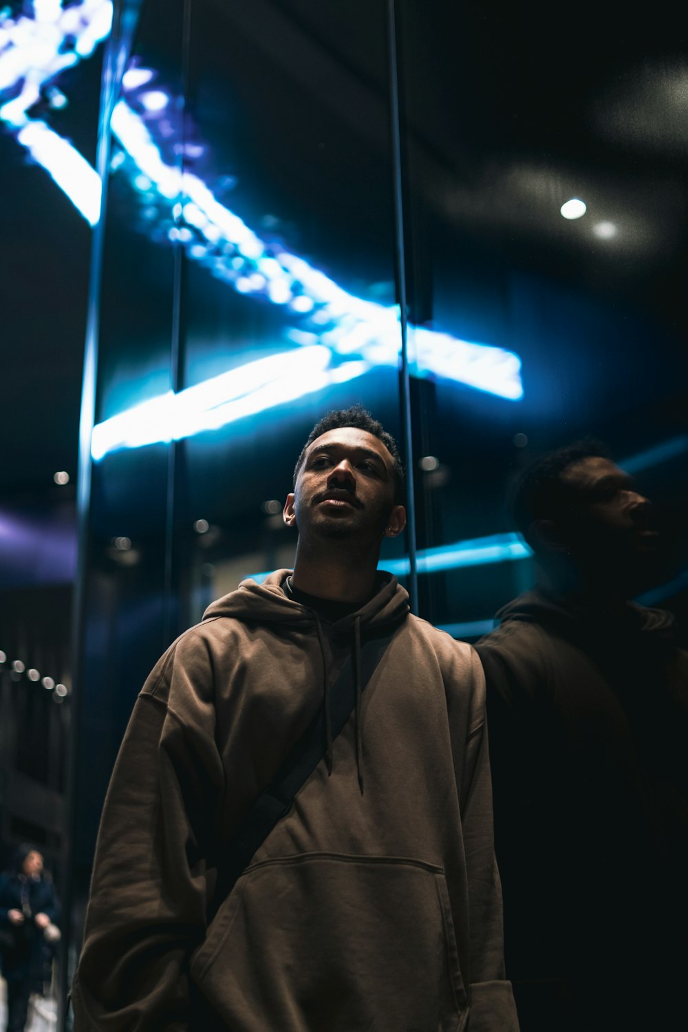 a man standing in front of a mirror