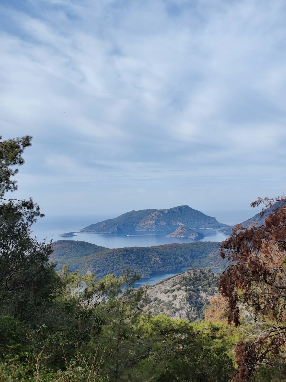 a view of a mountain range with a lake in the distance