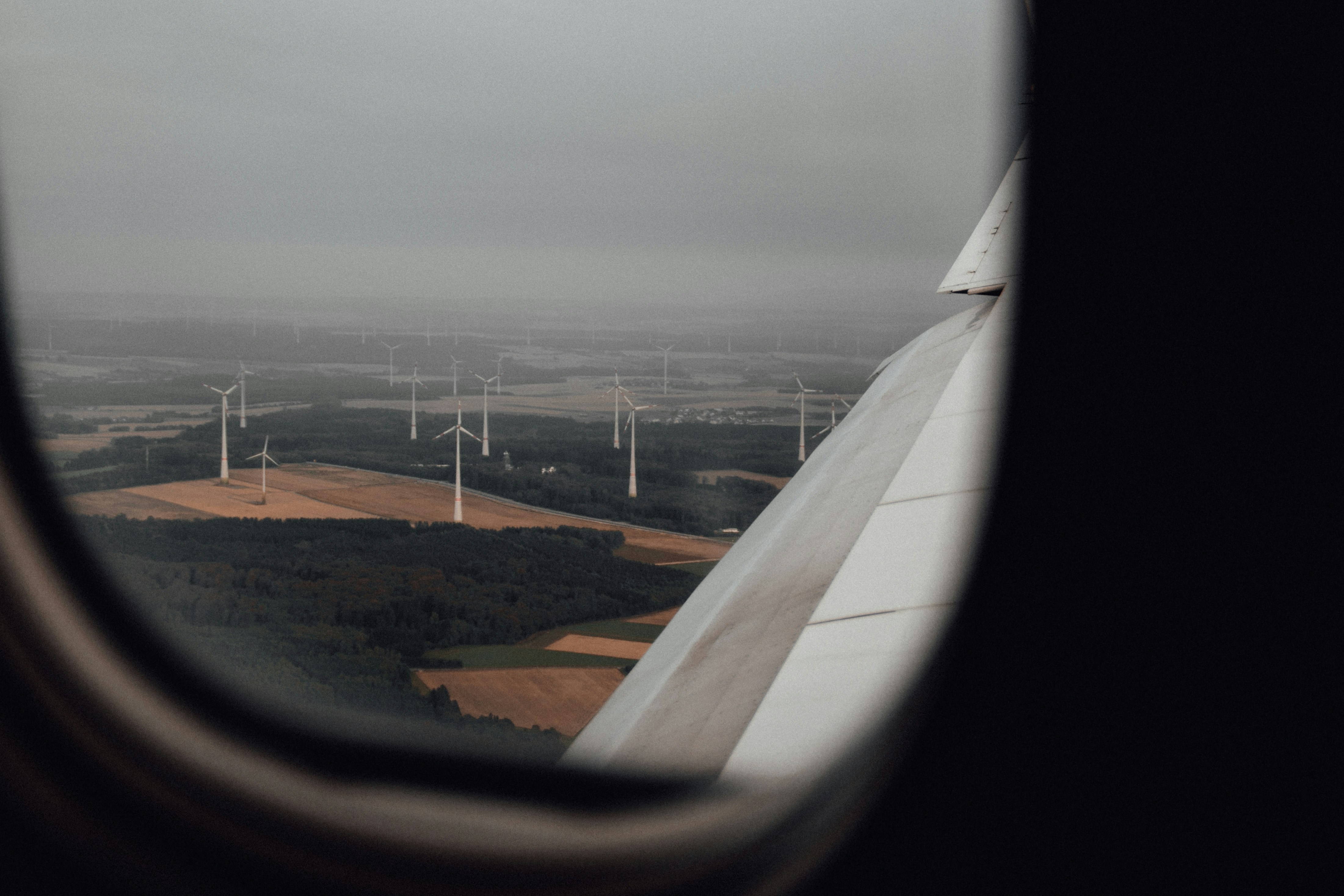 a view of a wind farm from an airplane window