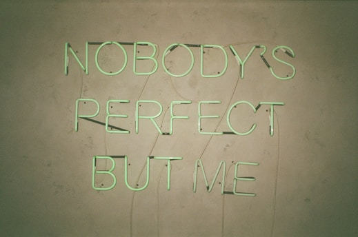 a neon sign that says nobody's perfect but me