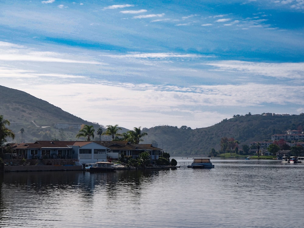 a body of water with houses and boats on it