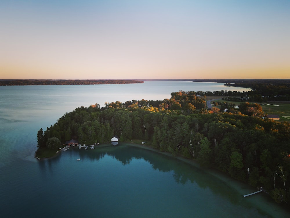 an aerial view of a lake surrounded by trees