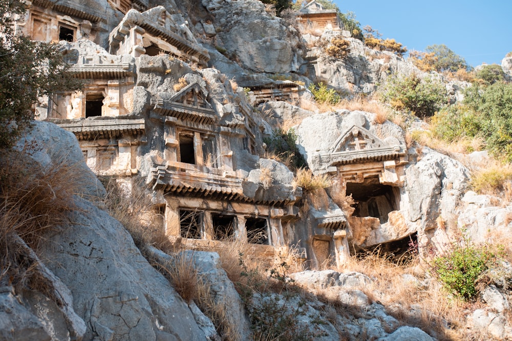 a group of buildings built into the side of a mountain