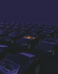 a parking lot filled with lots of parked cars
