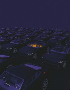 a parking lot filled with lots of parked cars