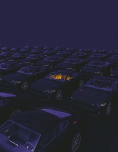 a parking lot filled with lots of parked cars