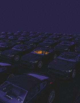 a parking lot filled with lots of parked cars