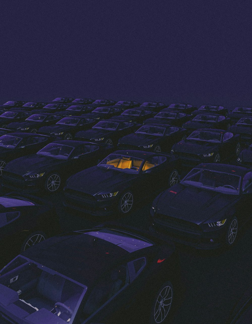 a parking lot filled with lots of parked cars