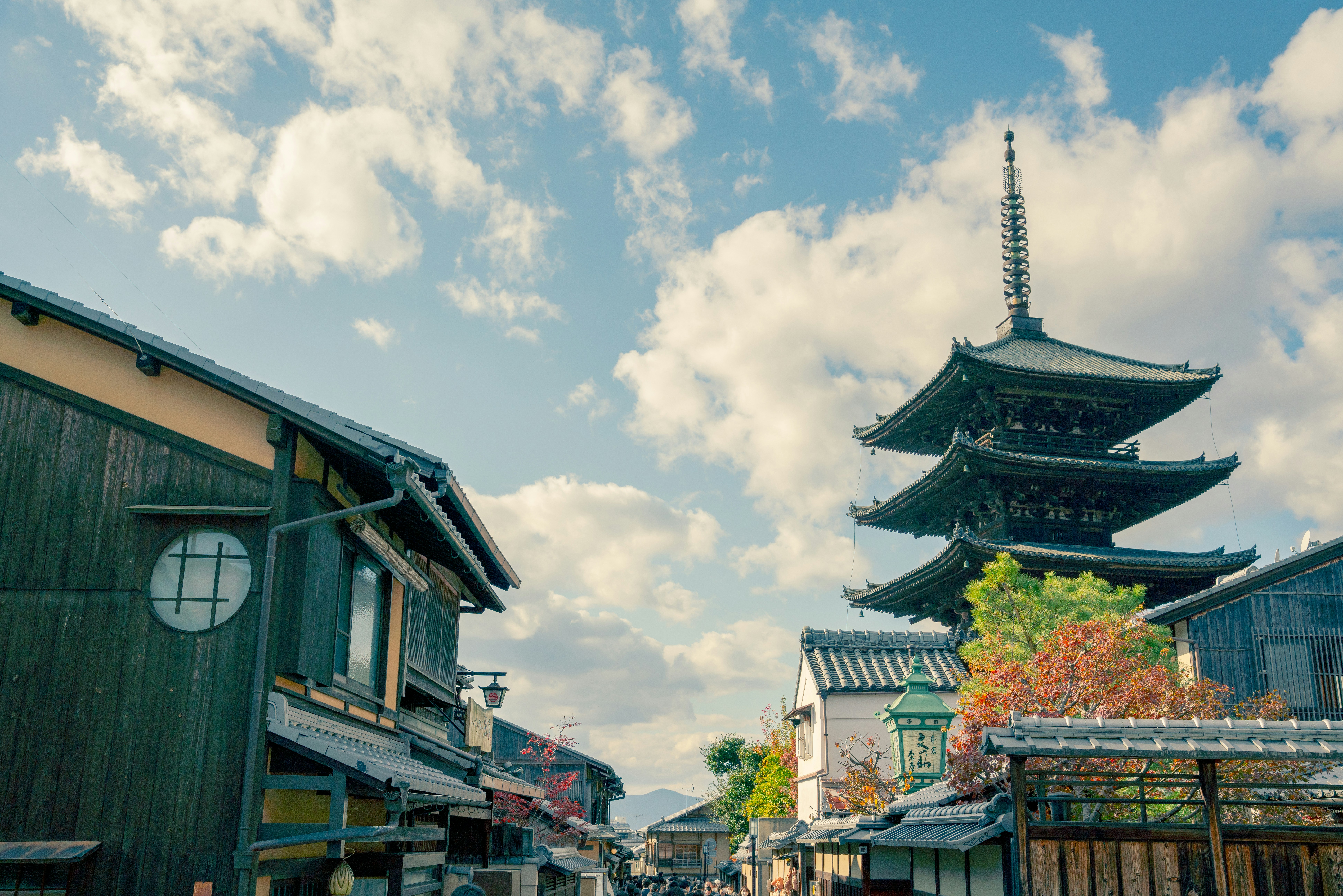 a street with a pagoda in the background