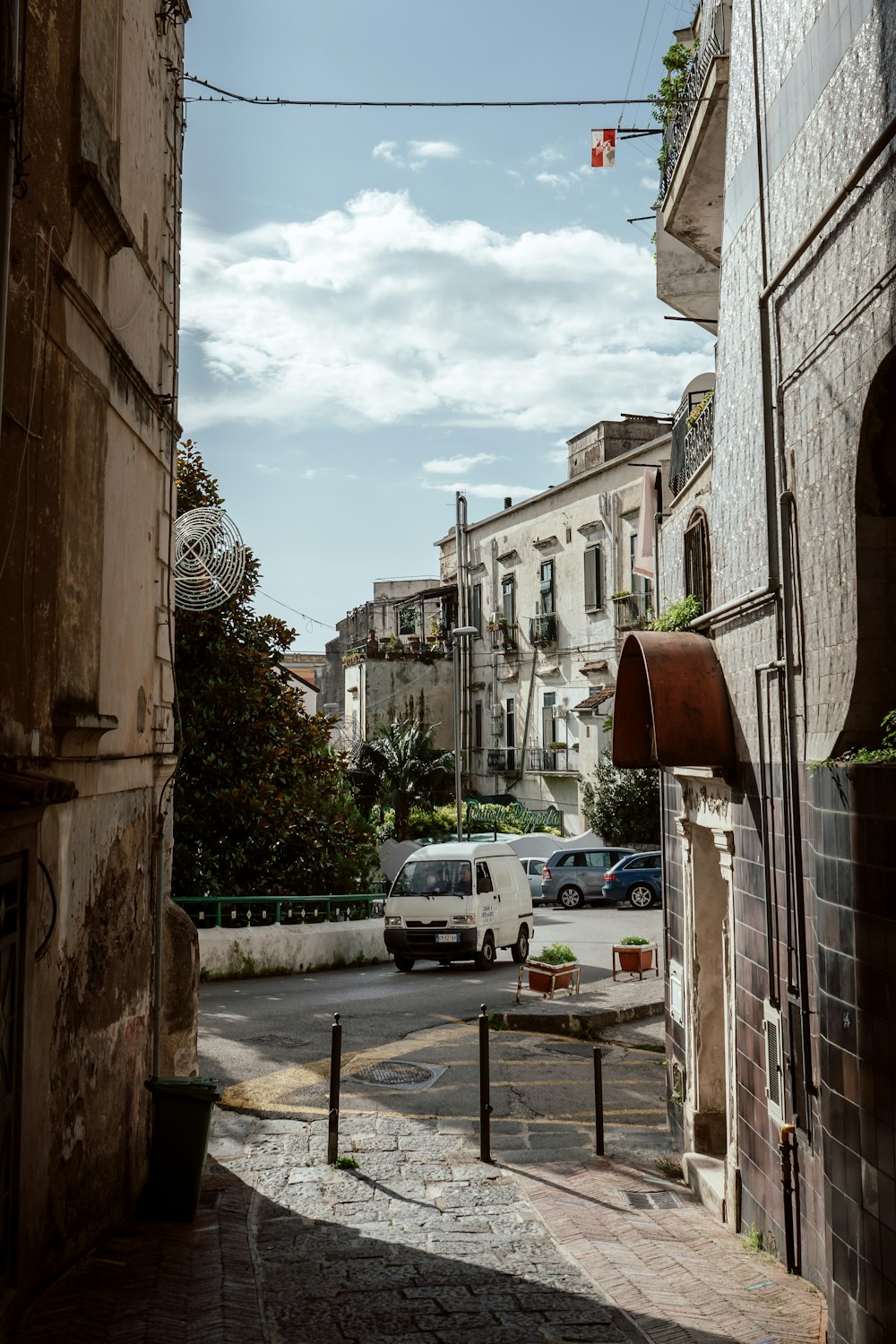 a city street with cars parked on the side of it