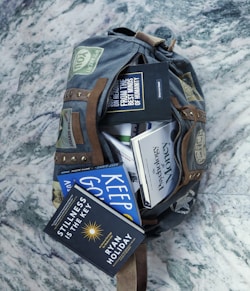 a backpack filled with books and other items