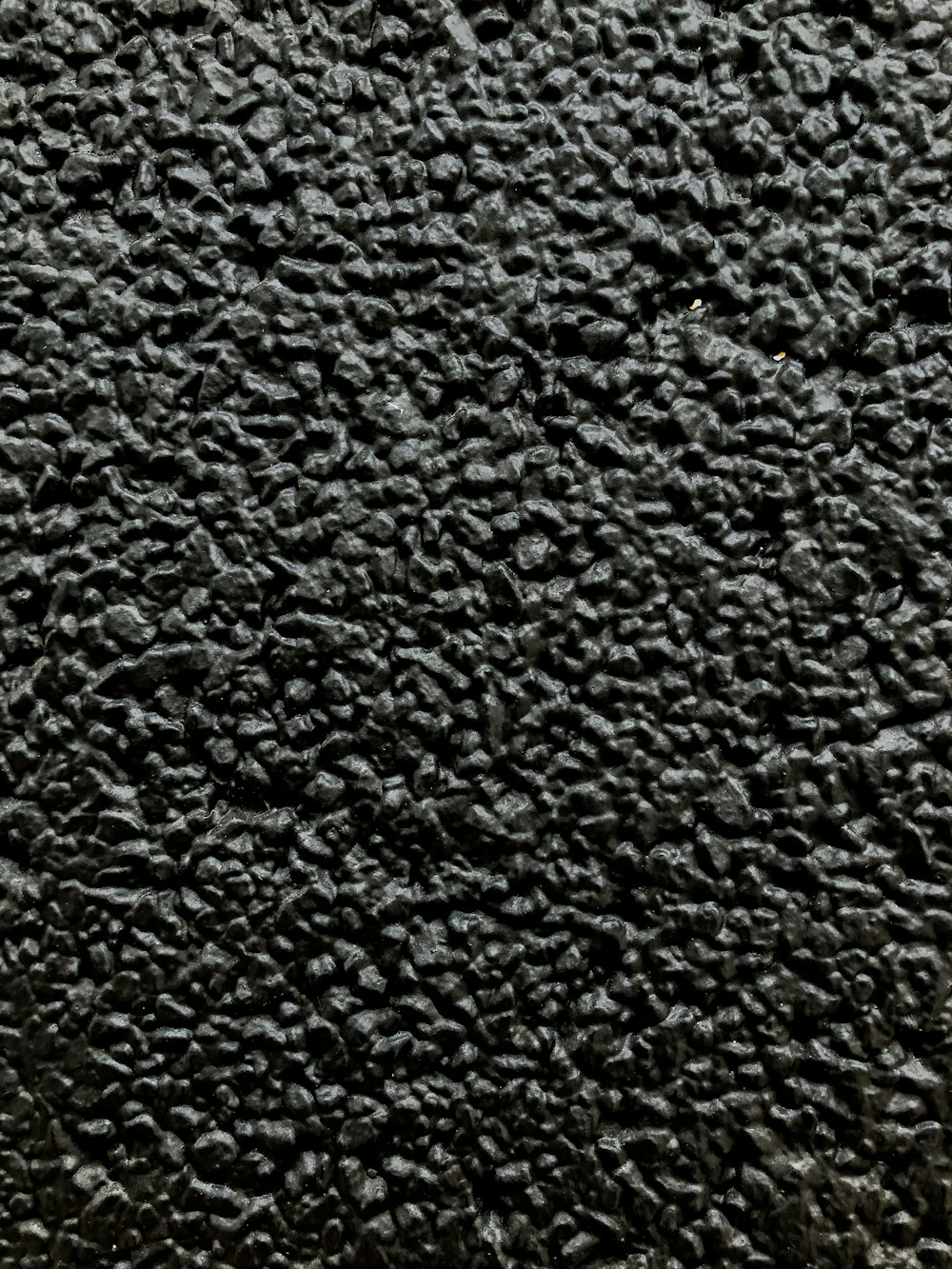 a close up of a black textured surface