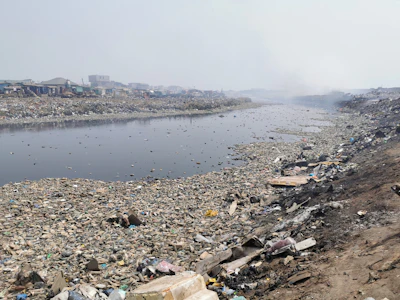 Old Fadama, Accra — waste and debris on riverside before cleanup