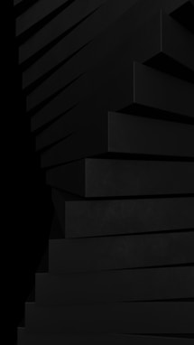 a stack of black boxes sitting on top of each other