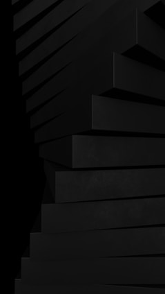 a stack of black boxes sitting on top of each other