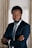 a man in a suit and tie posing for a picture
