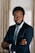 a man in a suit and tie posing for a picture