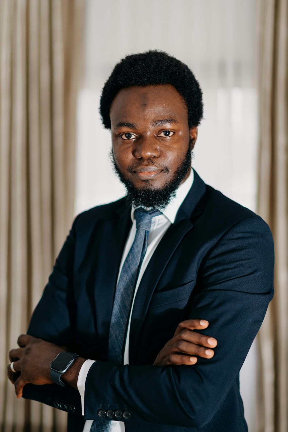 a man in a suit and tie posing for a picture