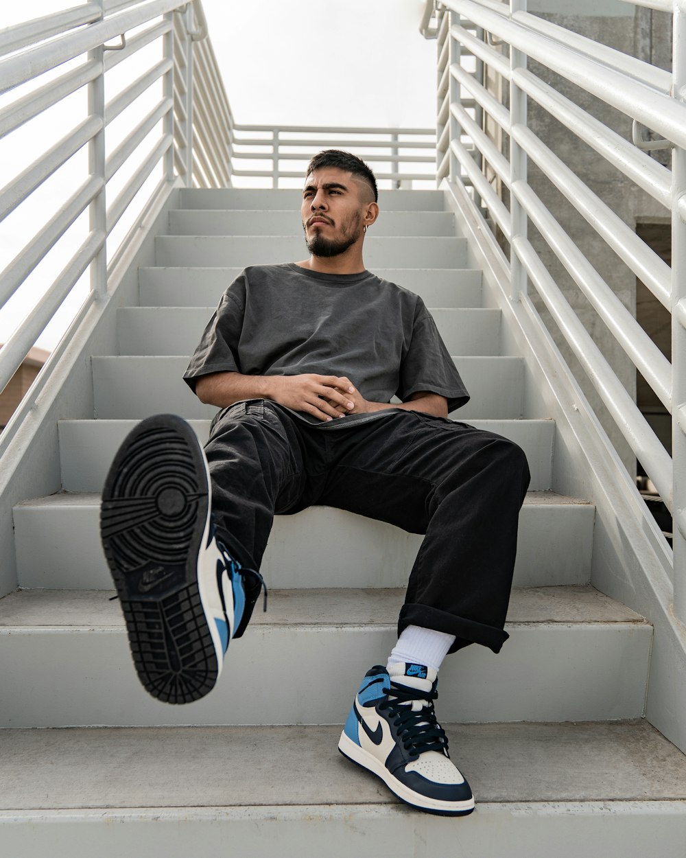 a man sitting on a set of stairs