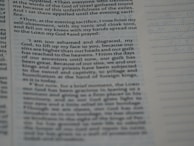 A close-up view of a page from a book, highlighting a section of text. The left side contains paragraphs with a large margin, and lines of text extend to the middle of the page. The right side is mostly blank except for a series of evenly spaced horizontal lines.