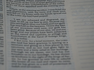A close-up view of a page from a book, highlighting a section of text. The left side contains paragraphs with a large margin, and lines of text extend to the middle of the page. The right side is mostly blank except for a series of evenly spaced horizontal lines.