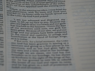 A close-up view of a page from a book, highlighting a section of text. The left side contains paragraphs with a large margin, and lines of text extend to the middle of the page. The right side is mostly blank except for a series of evenly spaced horizontal lines.