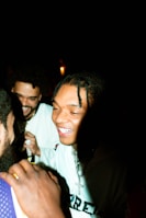 Smiling members sharing laughter and camaraderie during a Friday night gathering at the club.