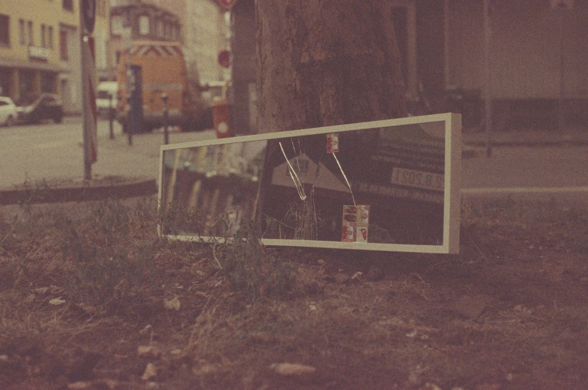 A vintage television on grass beside a tree, unrelated to church volunteer management or event coordination.