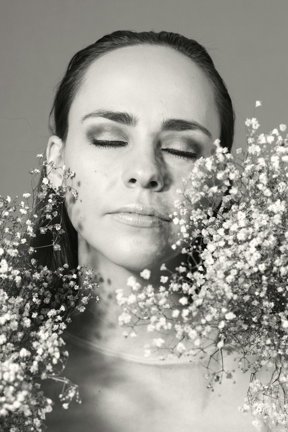 a woman with a bunch of flowers in her hair