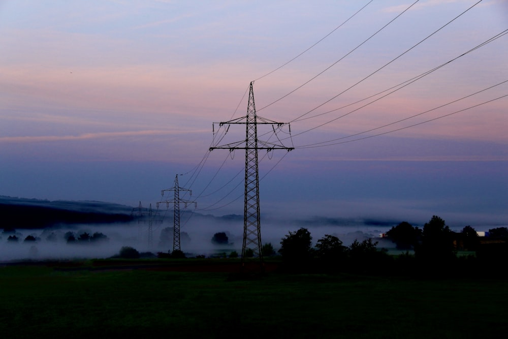 a power line with fog in the background
