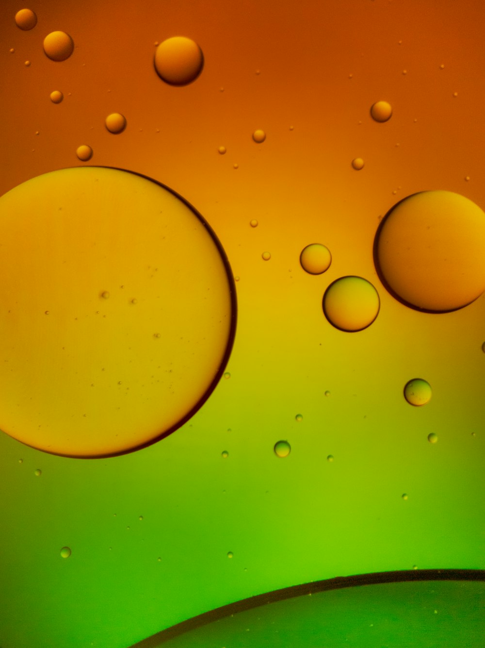 a close up of a green and yellow liquid