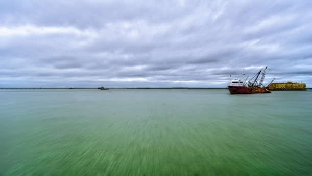 a large boat floating on top of a large body of water