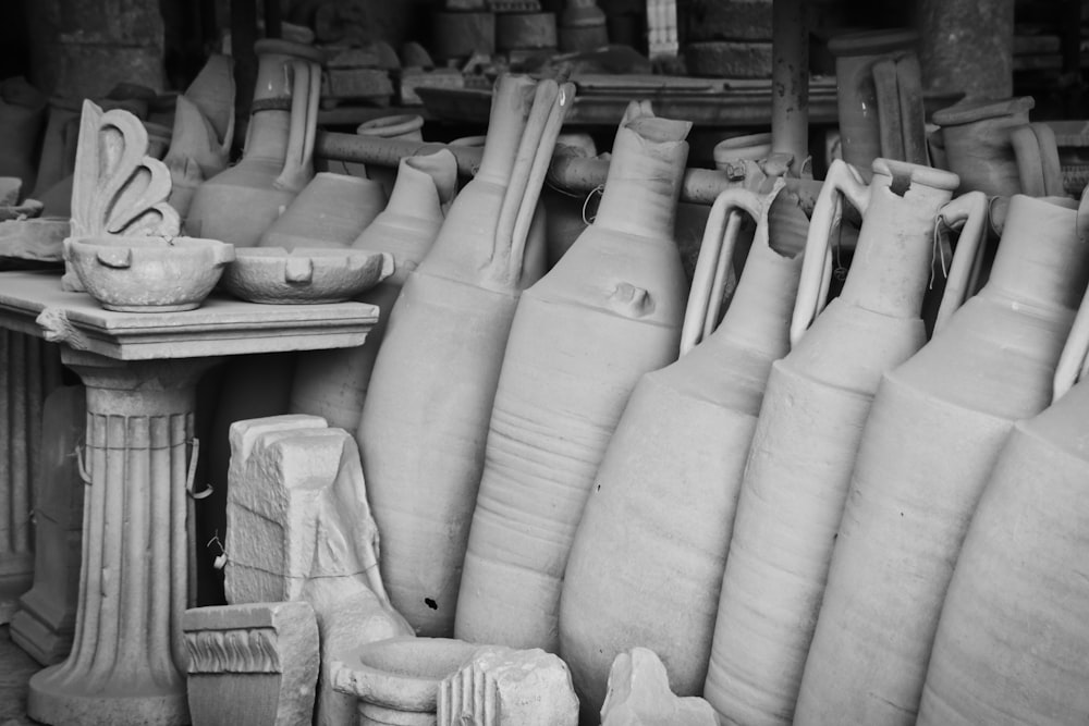 a bunch of vases that are sitting on a table