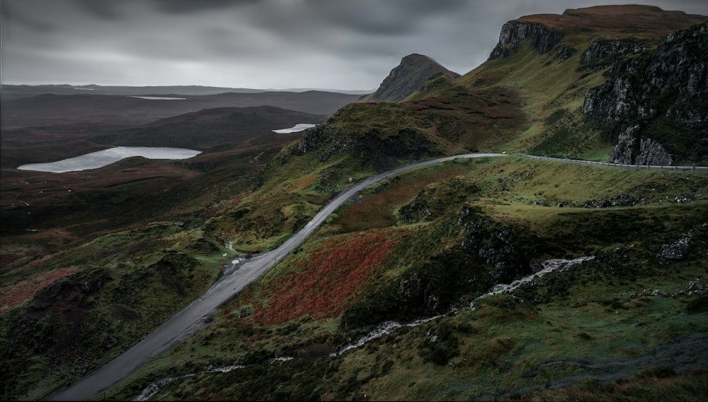 a winding road in the middle of a mountain range