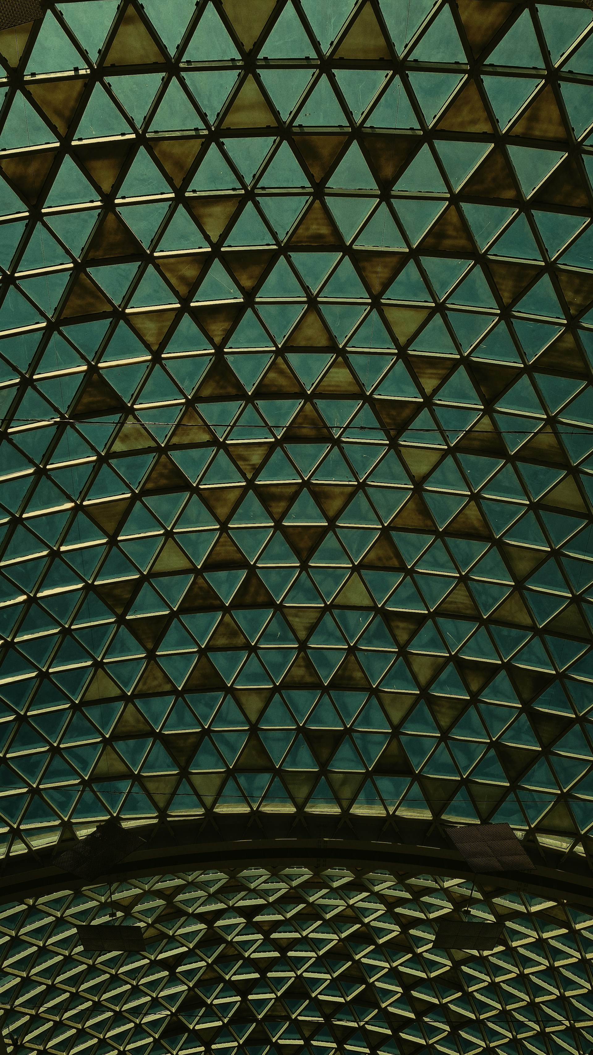 a view of the ceiling of a building from below