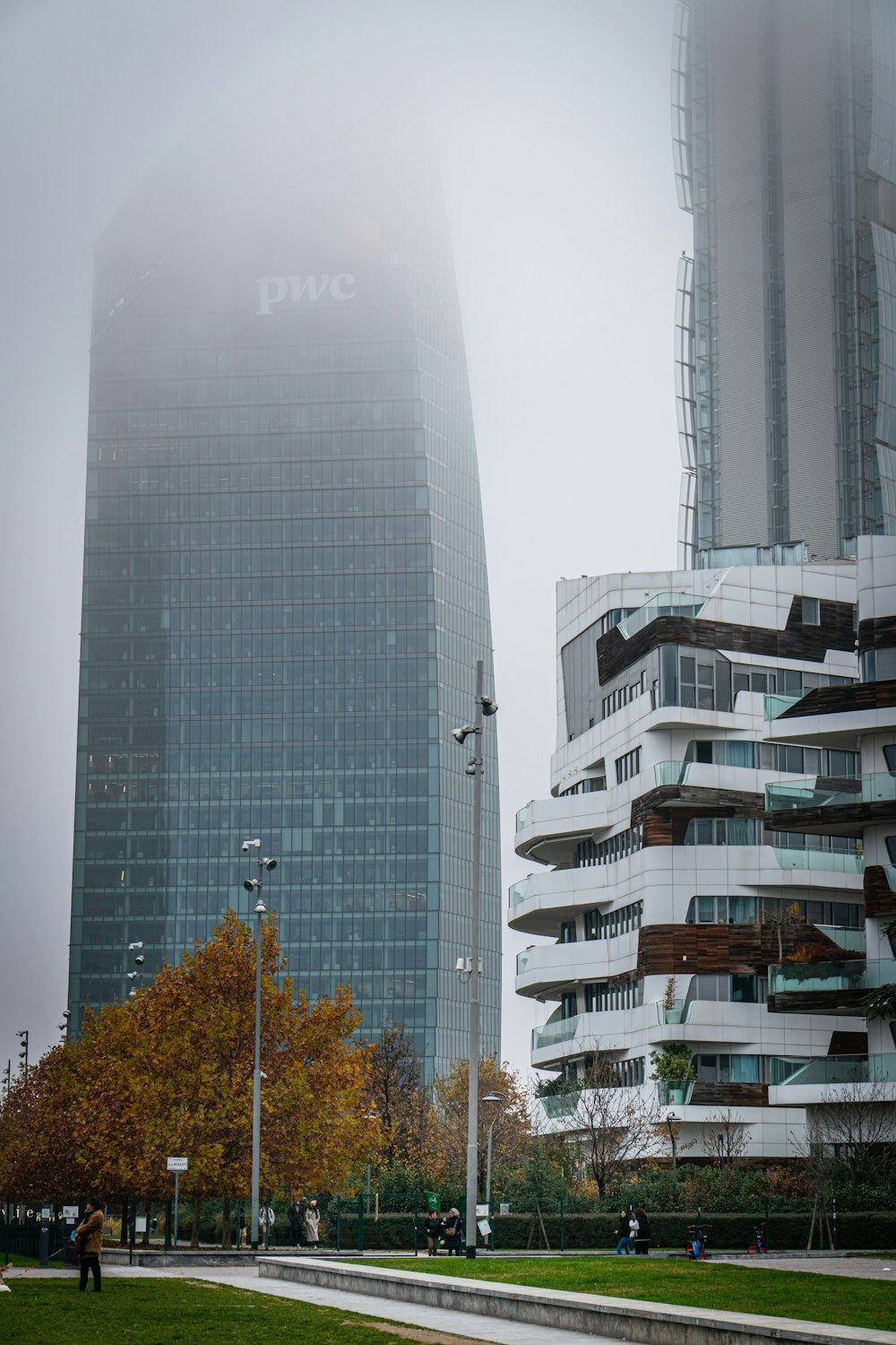 a foggy day in a city with tall buildings