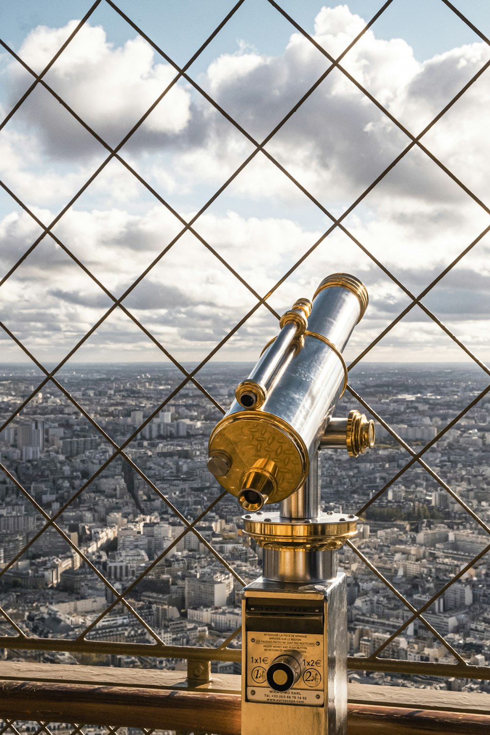 a telescope sitting on top of a metal structure